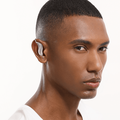 Feathered Grace ear cuff in silver worn on the ear, profile view