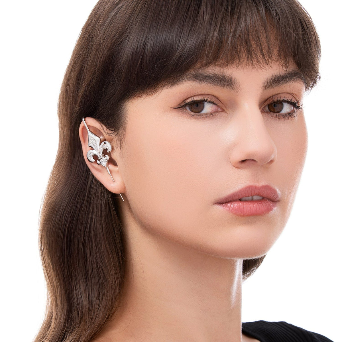 Fleur De Lys ear cuff worn on the ear, profile view