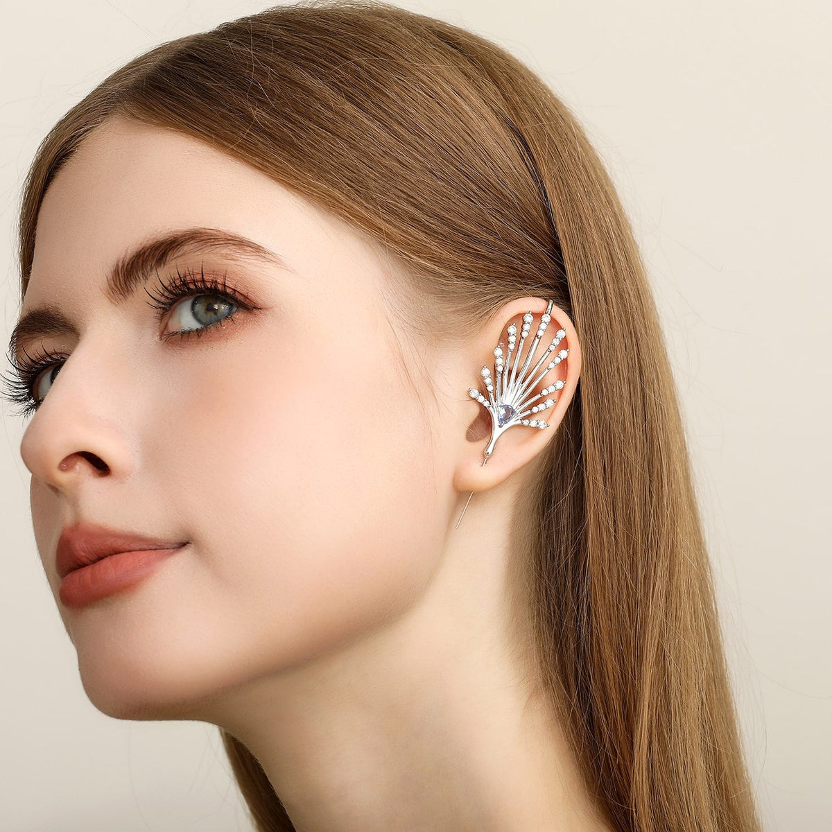 Ethereal Fountain ear cuff worn on the ear, profile view