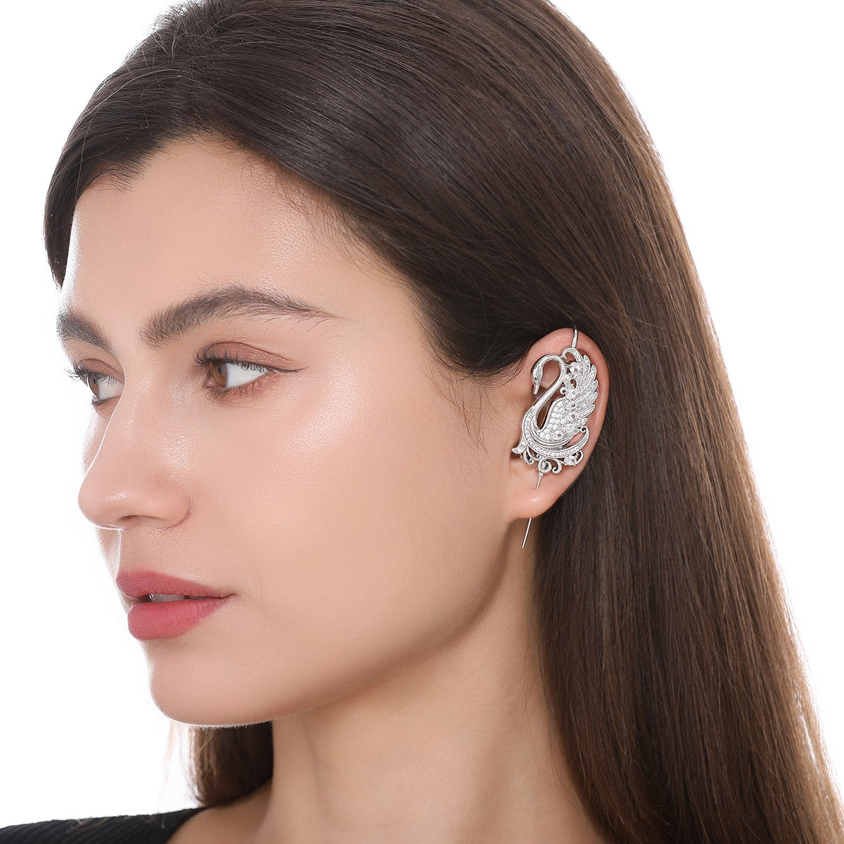 Graceful Swan ear cuff worn on the ear, profile view
