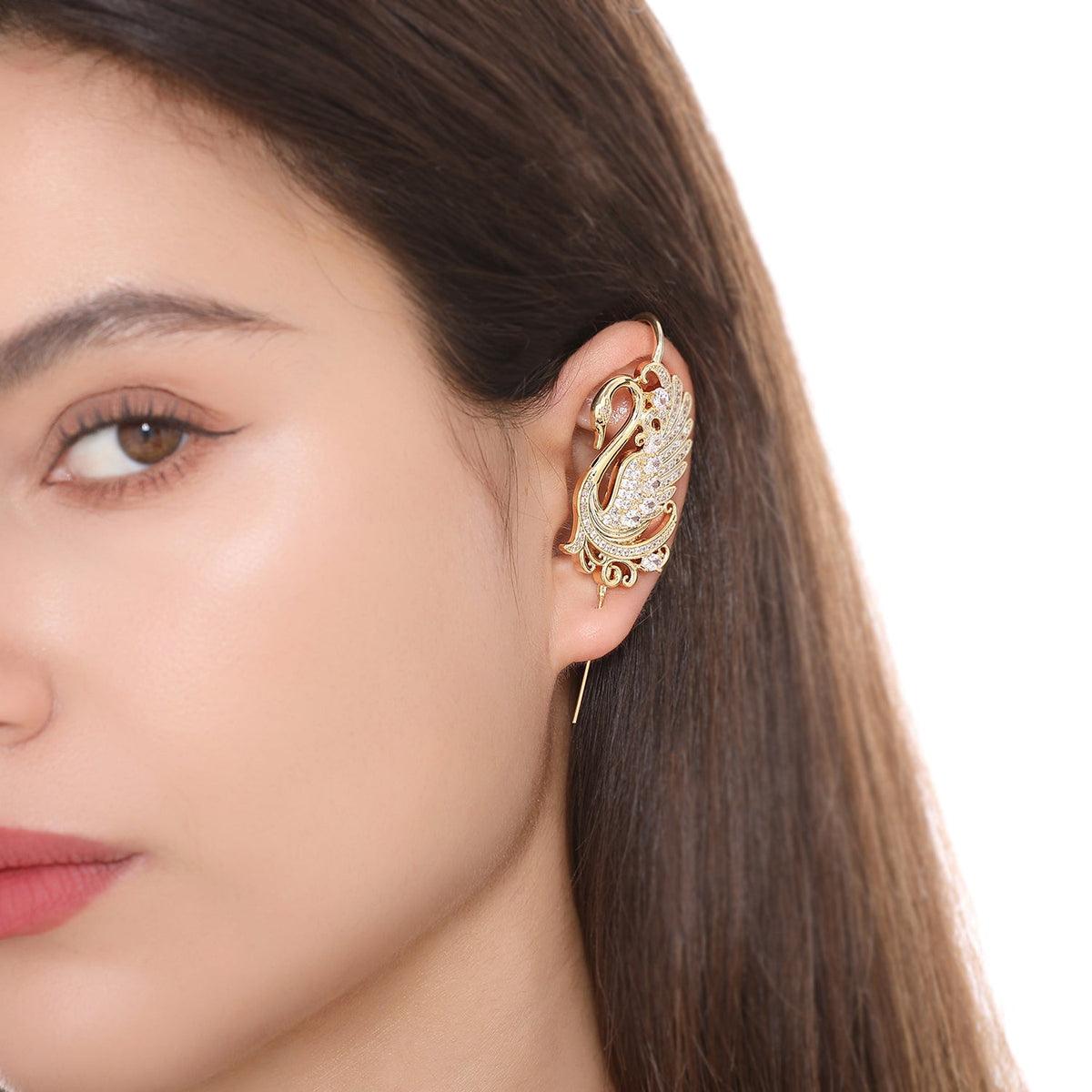 Graceful Swan ear cuff worn on the ear, profile view
