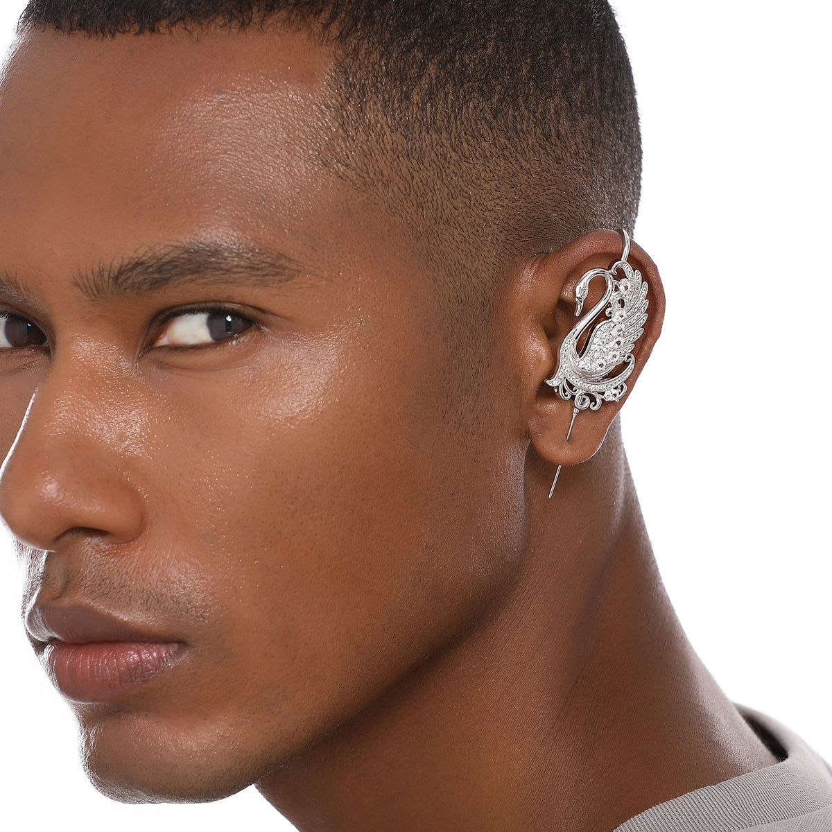 Graceful Swan ear cuff worn on the ear, profile view