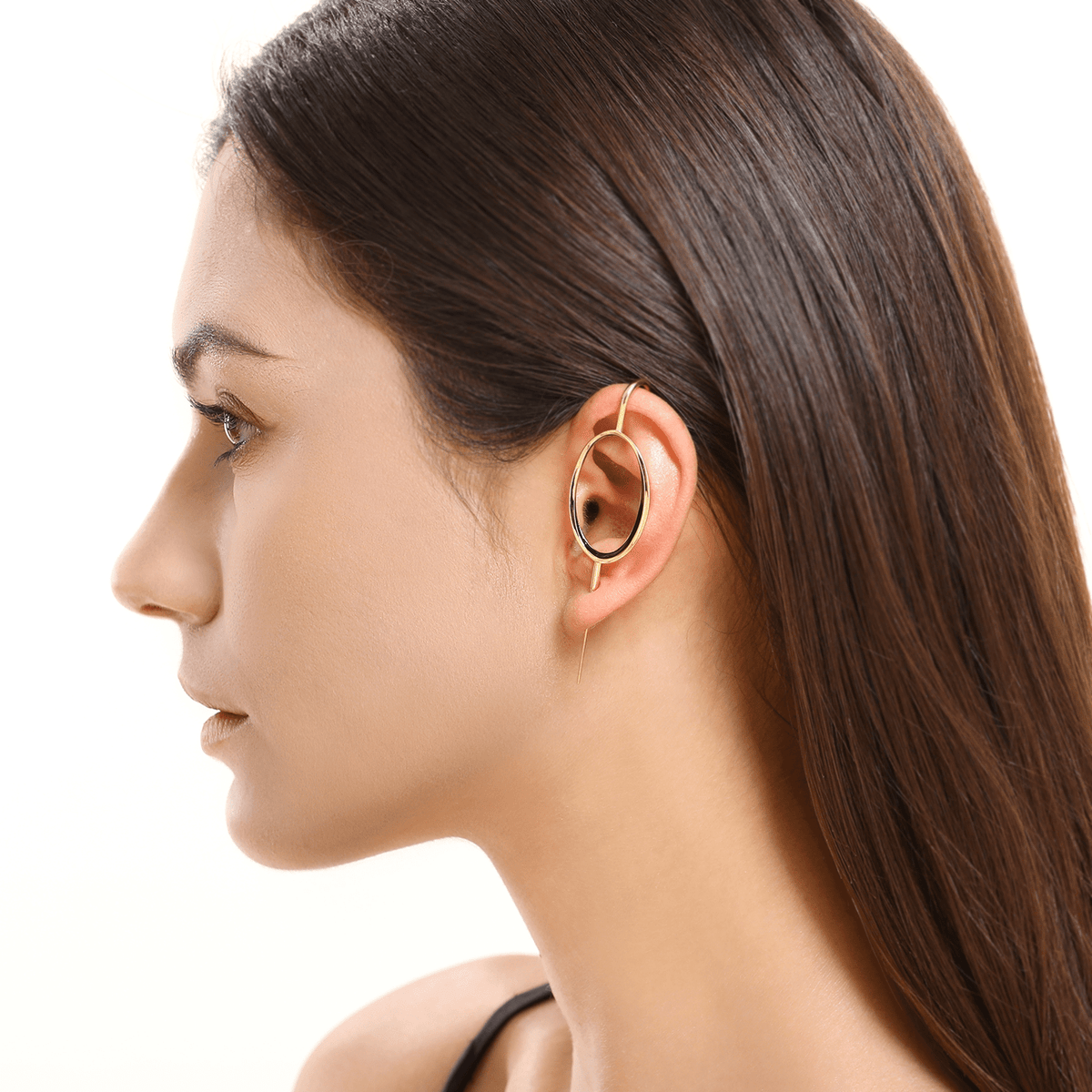 Halo ear cuff in gold worn on the ear, profile view