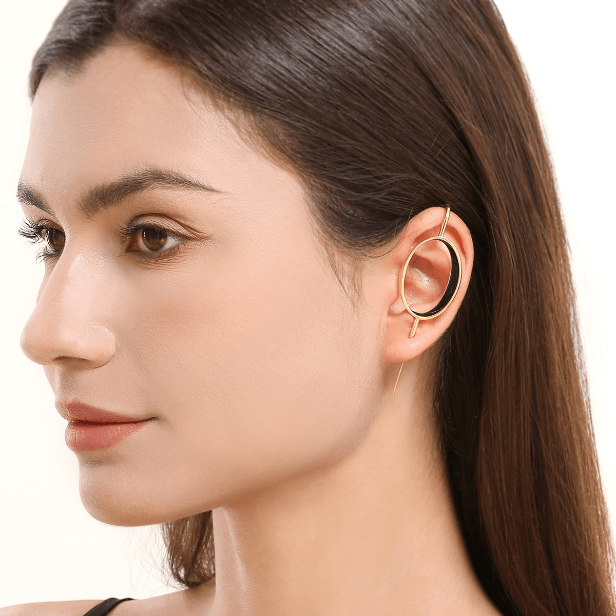 Halo ear cuff in gold worn on the ear, profile view