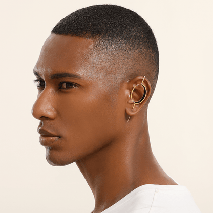 Halo ear cuff in gold worn on the ear, profile view