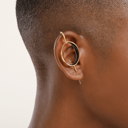Halo ear cuff in gold worn on the ear, profile view