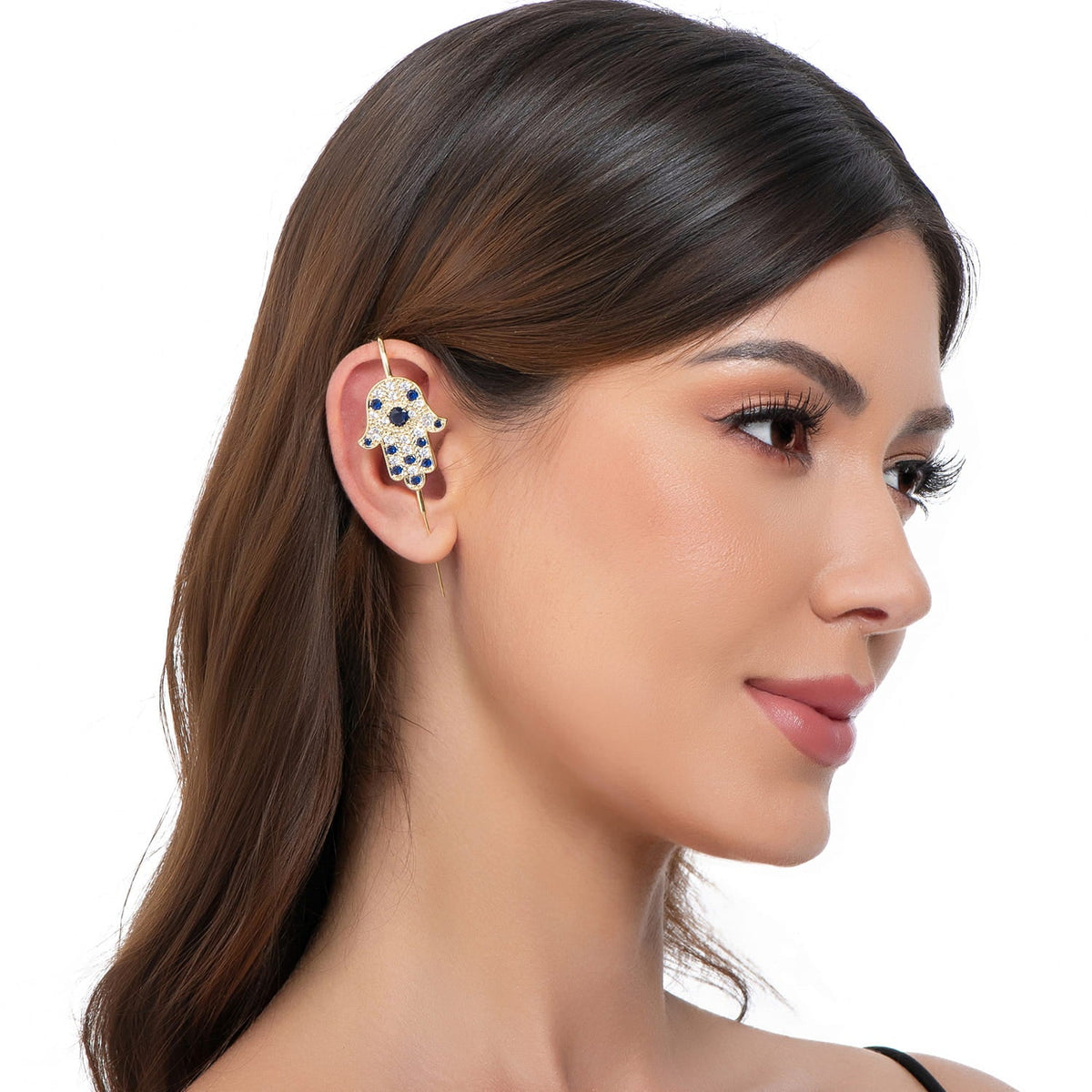 Hamsa ear cuff in gold on a black ear form