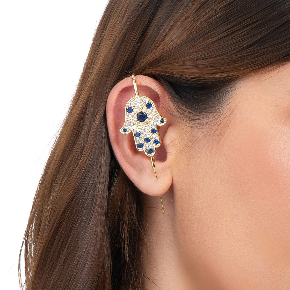 Hamsa ear cuff in gold on a black ear form