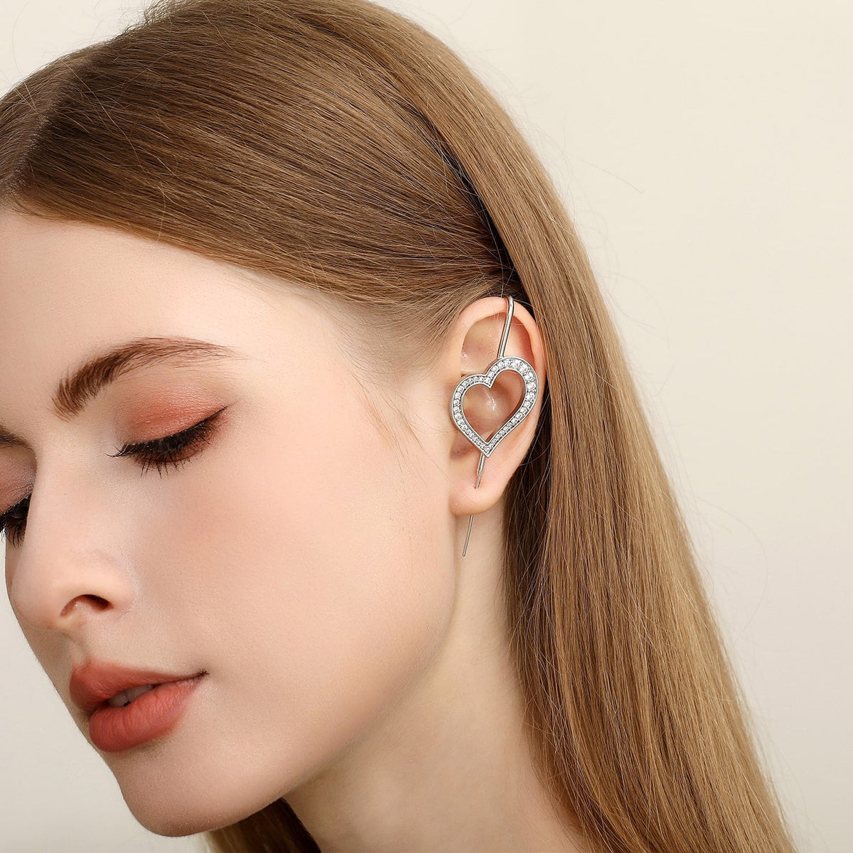 Pure Heart ear cuff worn on the ear, profile view