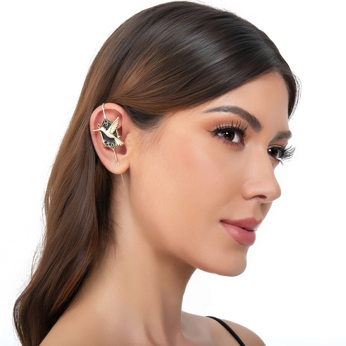 Hummingbird ear cuff in gold on a black ear form