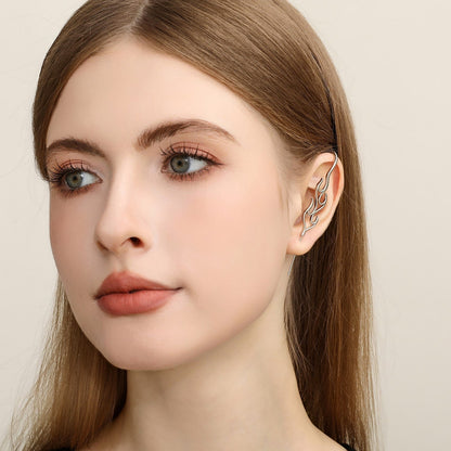 Inner Fire ear cuff worn on the ear, profile view