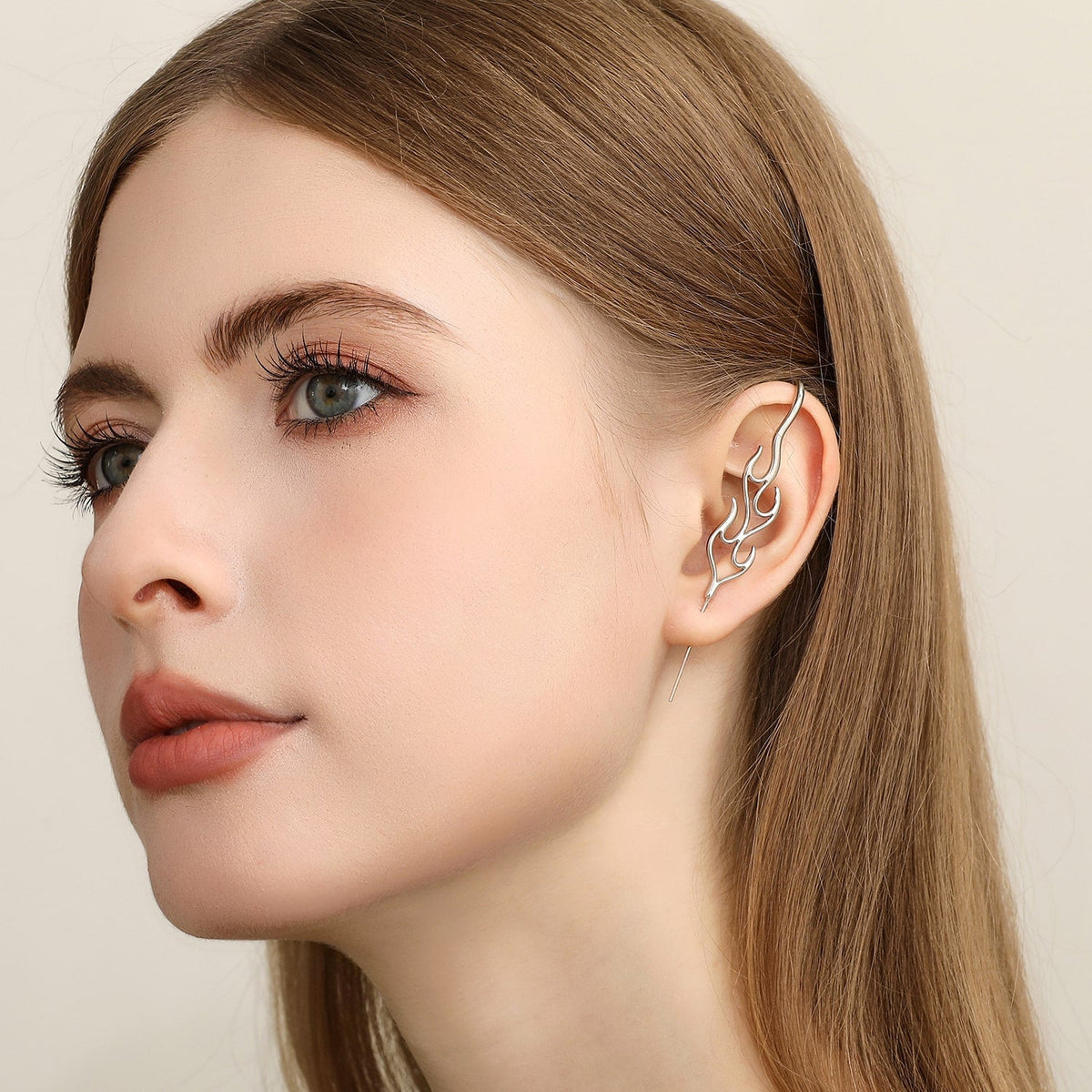 Inner Fire ear cuff worn on the ear, profile view