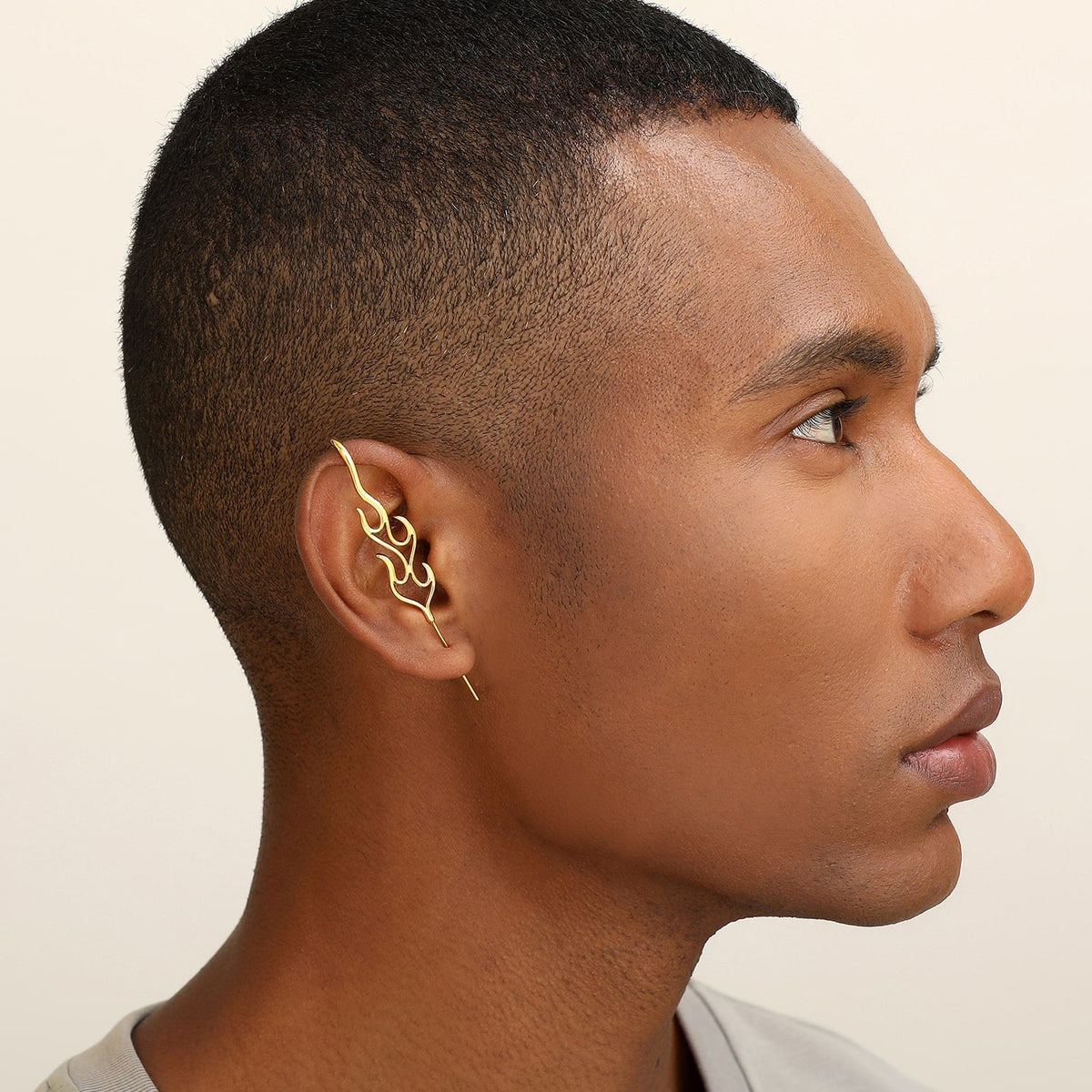 Inner Fire ear cuff worn on the ear, profile view