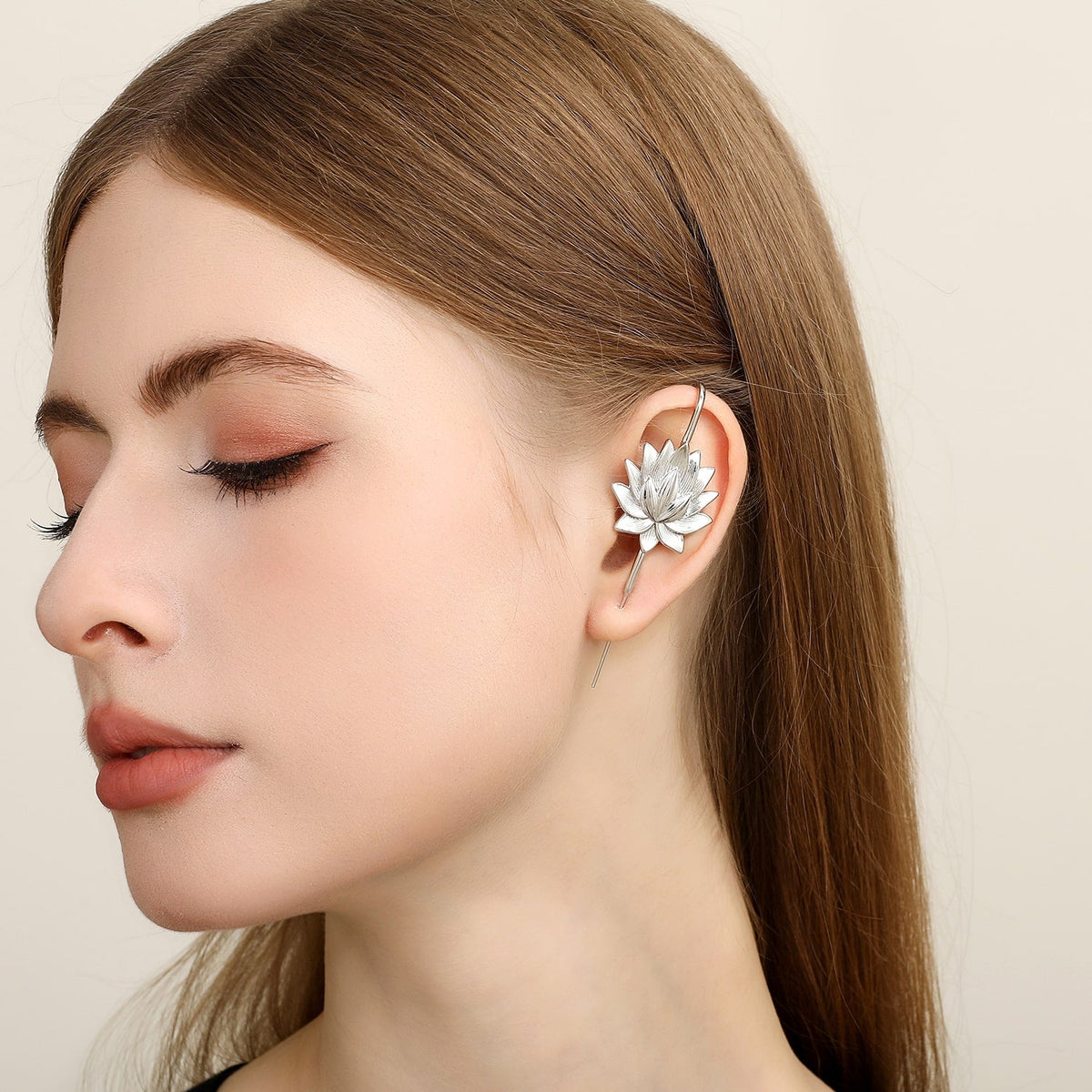 Lotus Bloom ear cuff worn on the ear, profile view