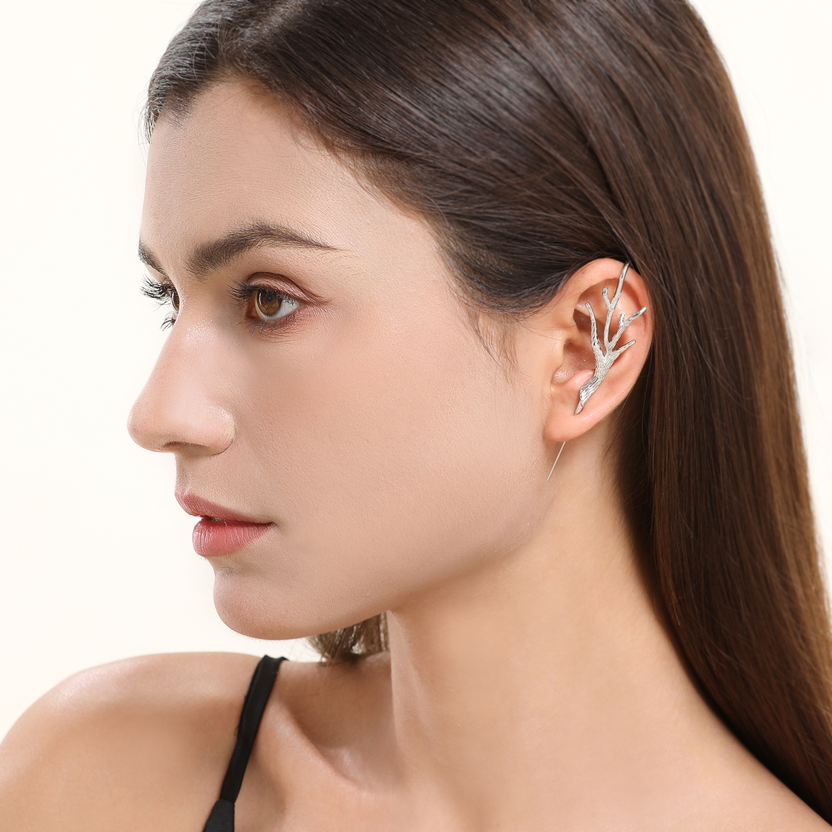 Nature's Embrace ear cuff in silver worn on the ear, profile view