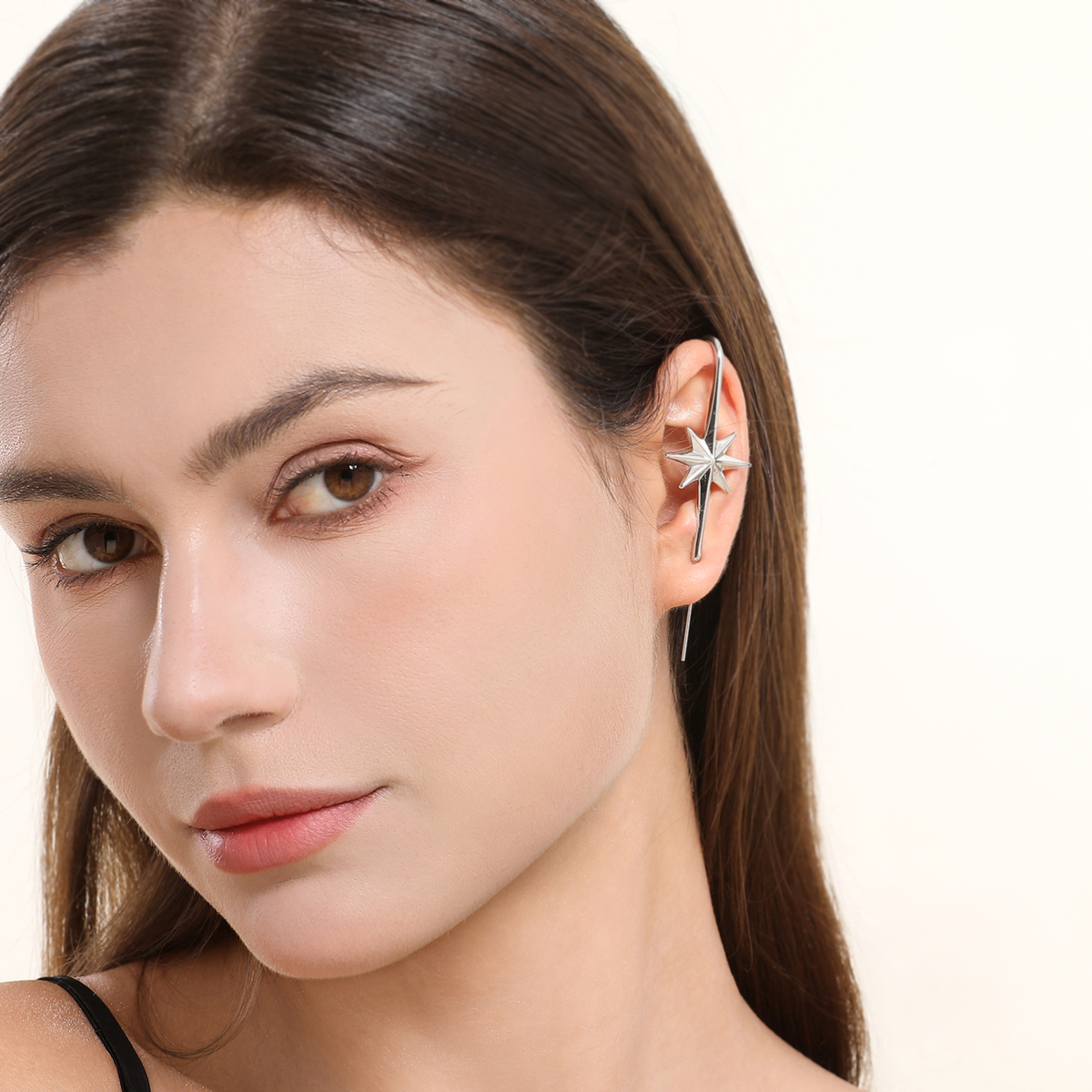 North Star ear cuff in silver worn on the ear, profile view
