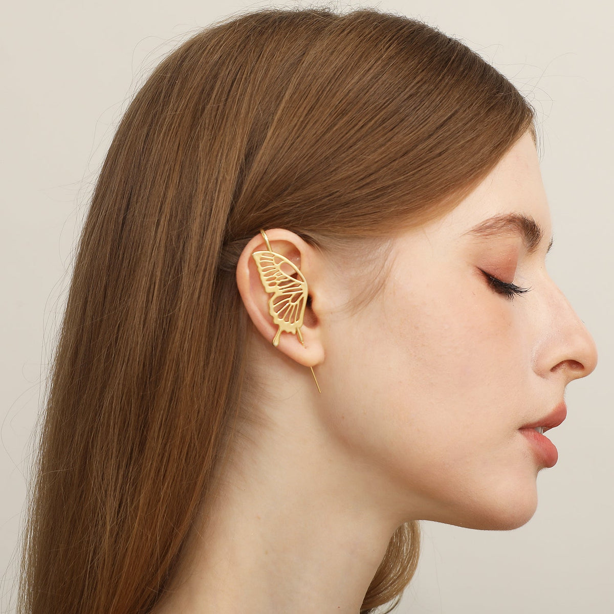 Gentle Butterfly ear cuff worn on the ear, profile view