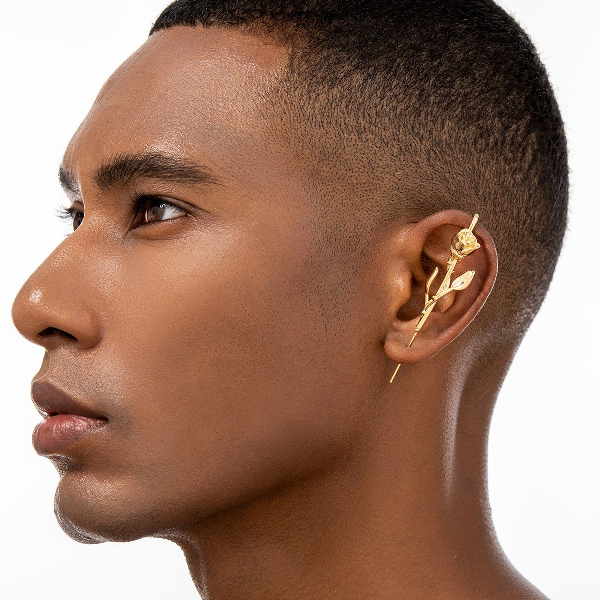 Radiant Rose ear cuff worn on the ear, profile view
