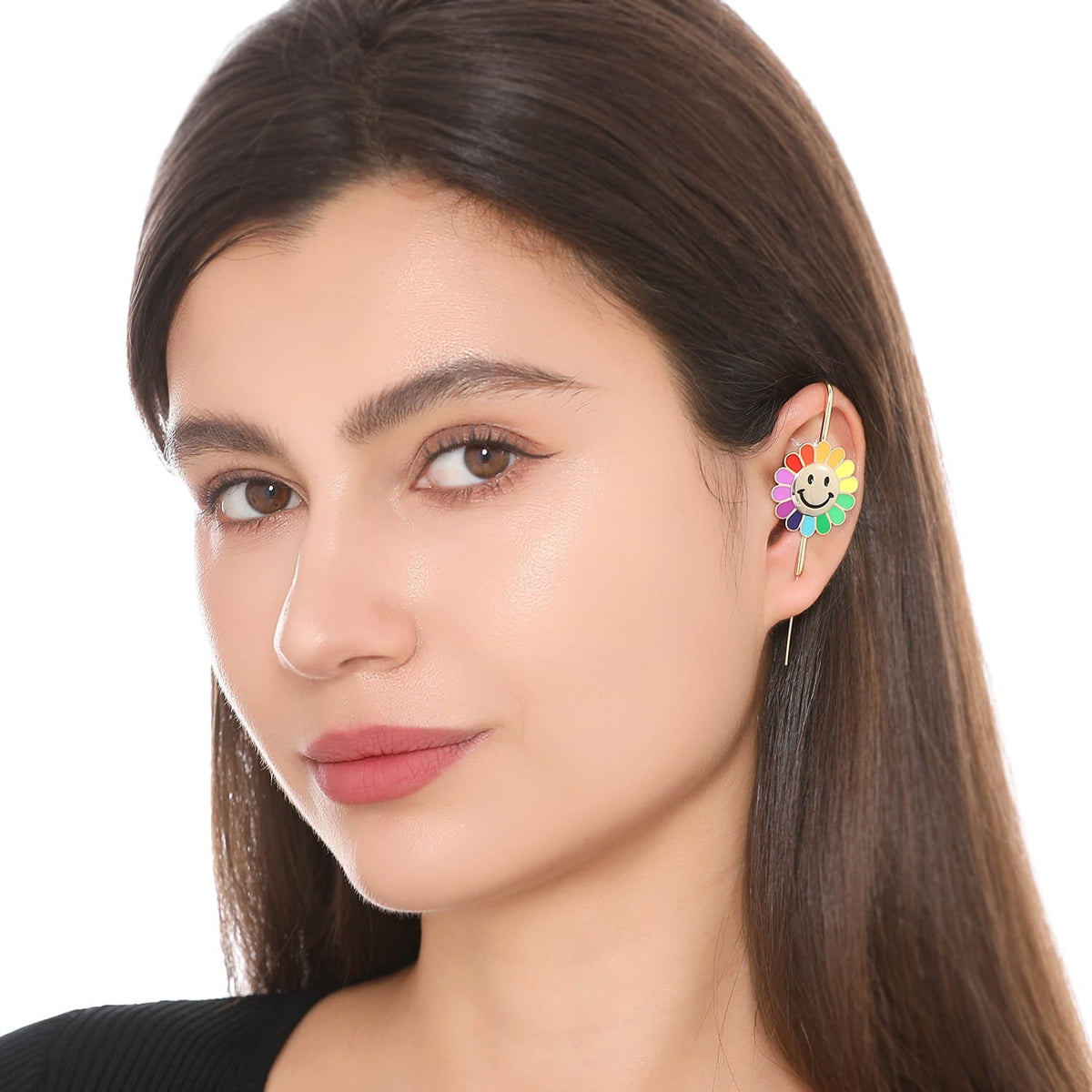 Rainbow Flower ear cuff worn on the ear, profile view
