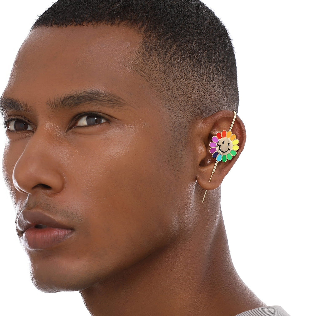 Rainbow Flower ear cuff worn on the ear, profile view