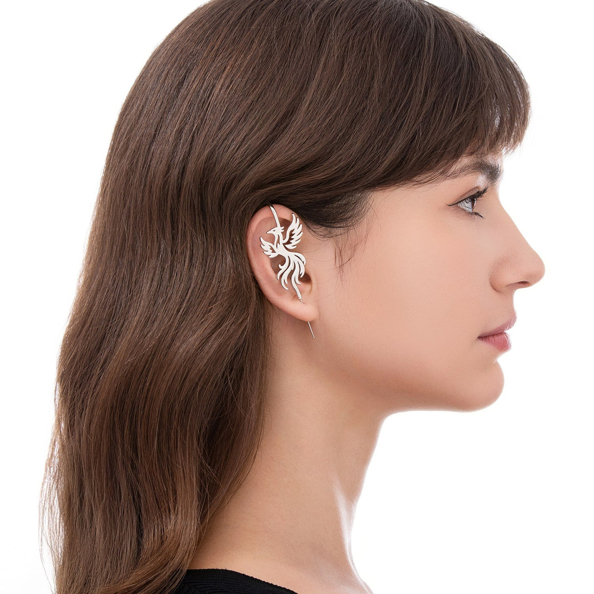 Rising Phoenix ear cuff worn on the ear, profile view