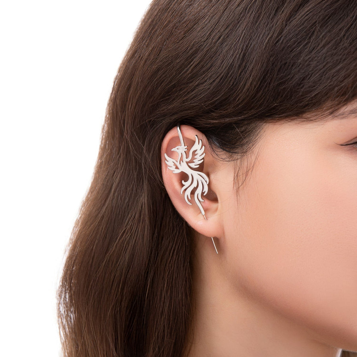 Rising Phoenix ear cuff worn on the ear, profile view