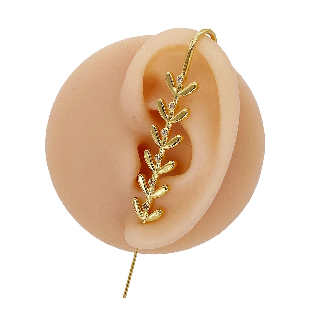 Flora ear cuff in gold on a black ear form