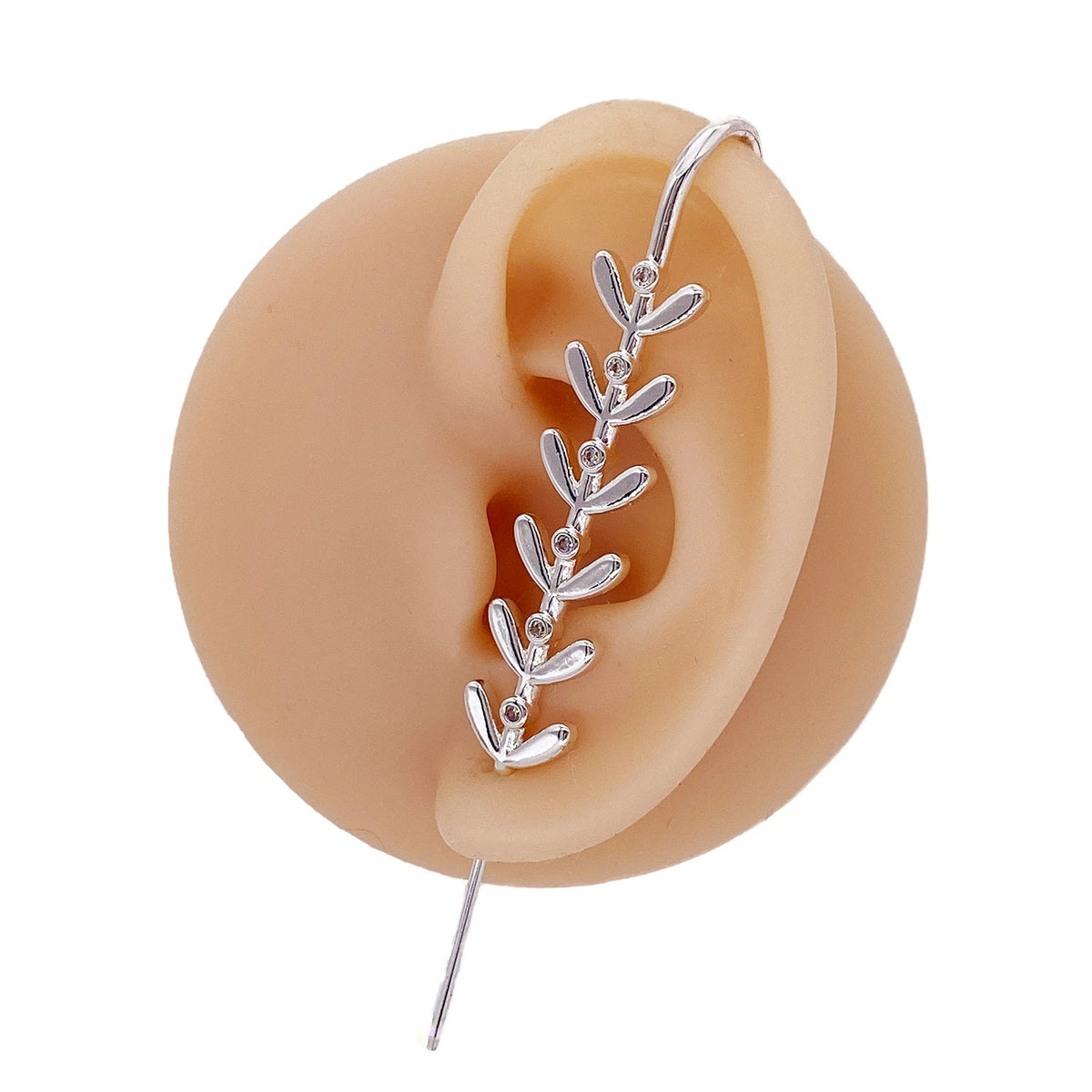 Flora ear cuff in silver on a black ear form