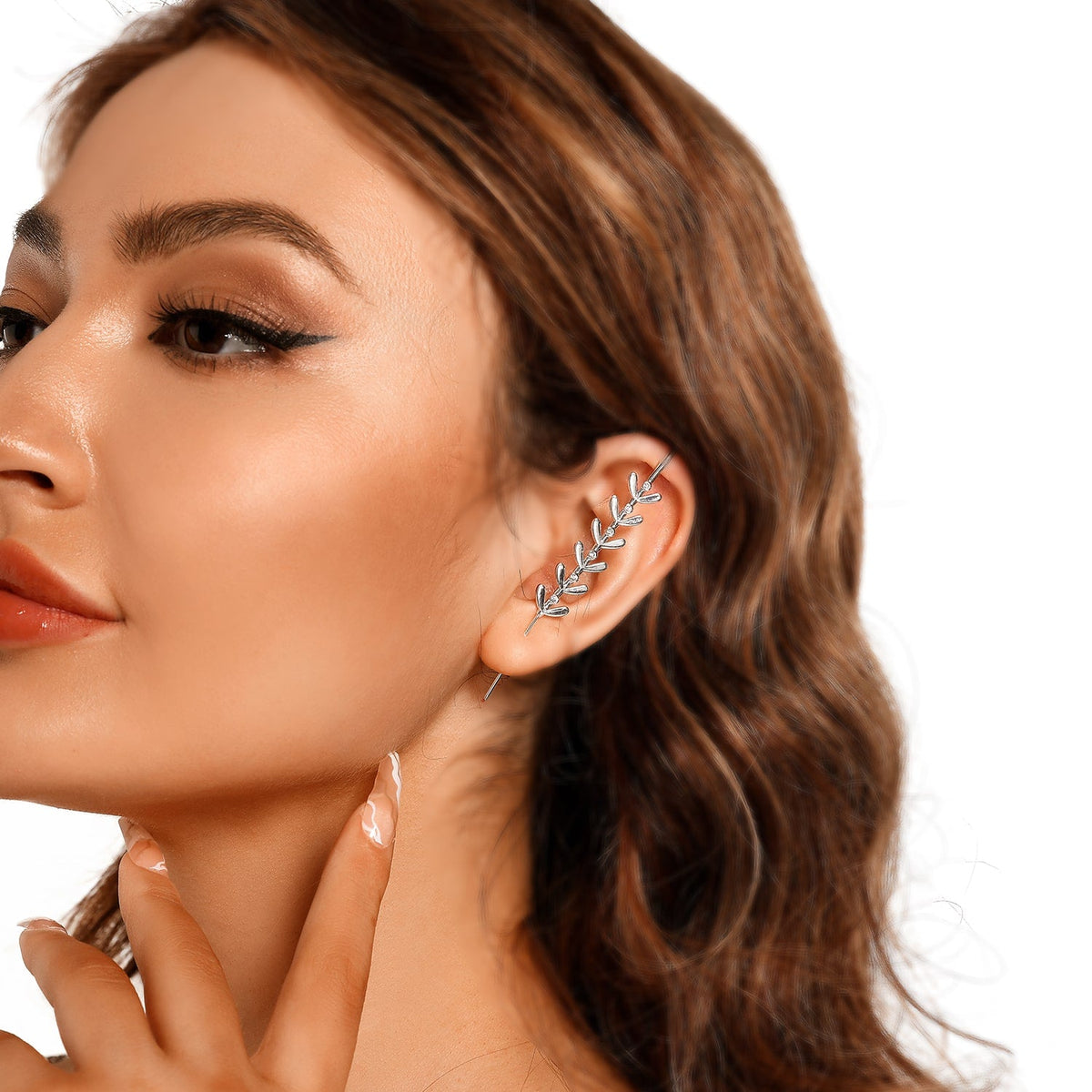 Flora ear cuff in silver on a black ear form