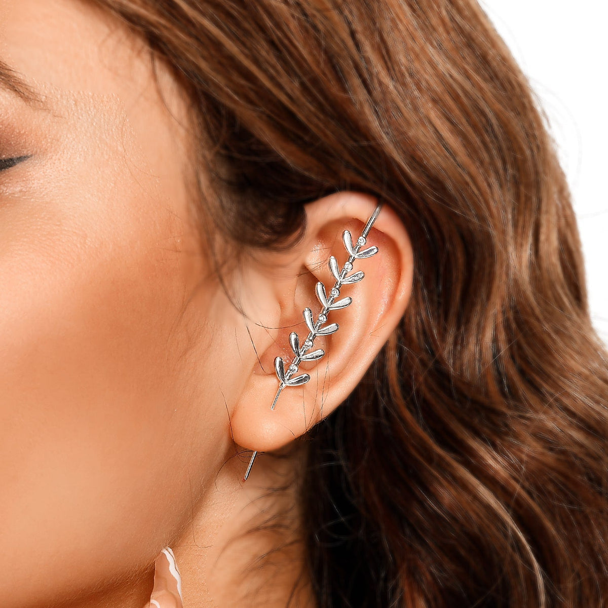 Flora ear cuff in silver on a black ear form