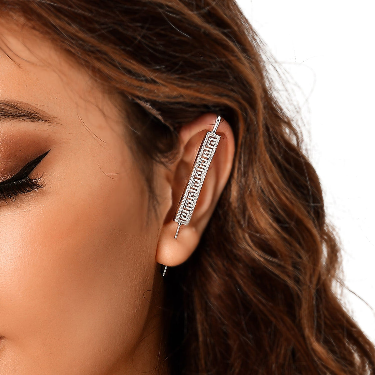 Tribal ear cuff in silver on a black ear form