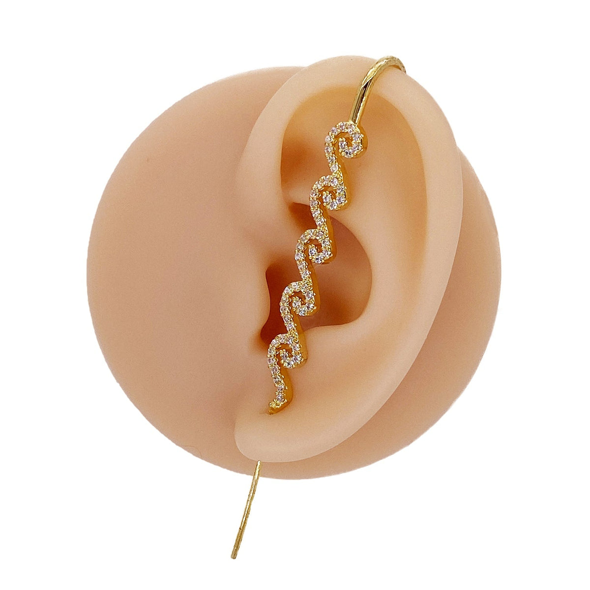 Ocean Waves ear cuff in gold on a black ear form