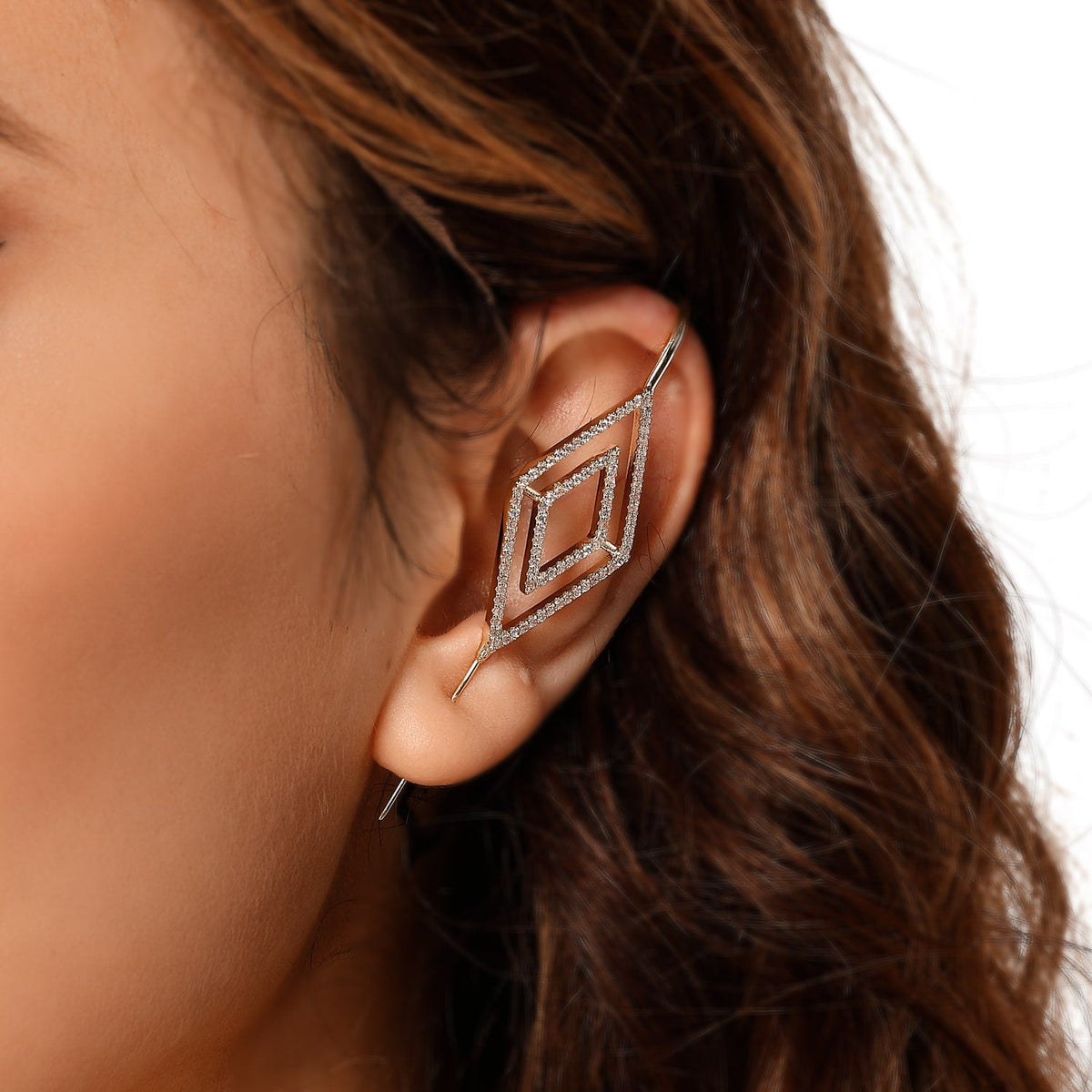 Diamond ear cuff in gold on a black ear form