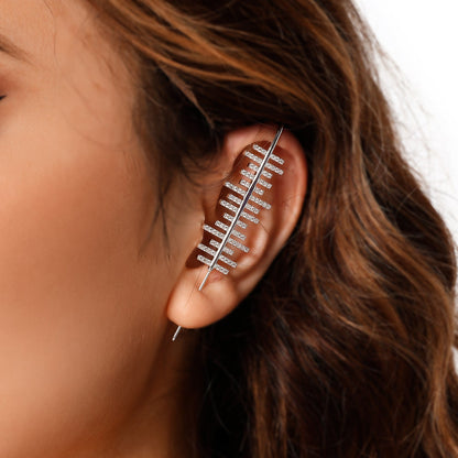Balance ear cuff in silver on a black ear form