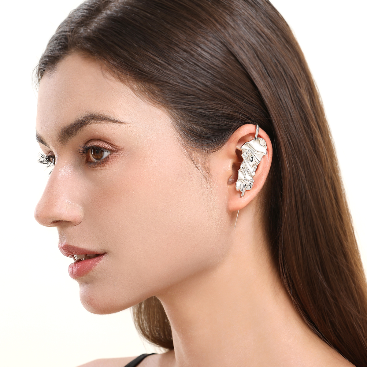 Sculpted Cascade ear cuff in silver worn on the ear, profile view
