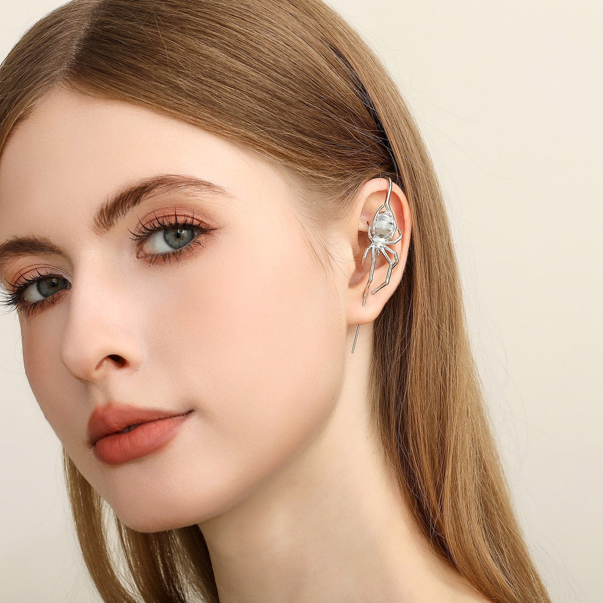 Arachnid Kiss ear cuff worn on the ear, profile view