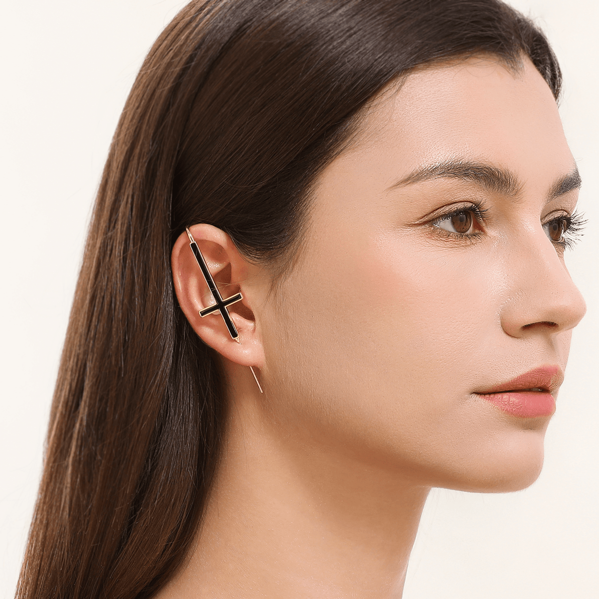 St. Peter Cross ear cuff in gold worn on the ear, profile view