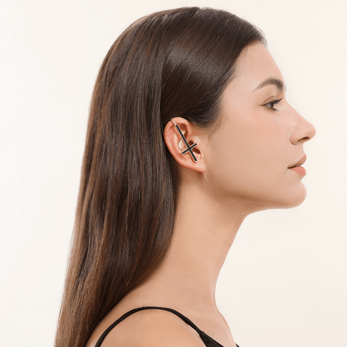 St. Peter Cross ear cuff in gold worn on the ear, profile view