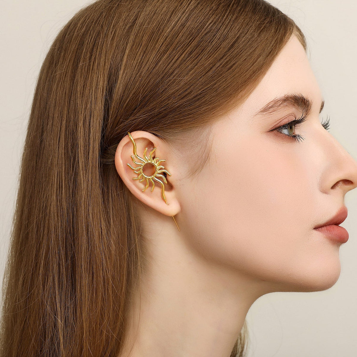 Sunfire ear cuff worn on the ear, profile view
