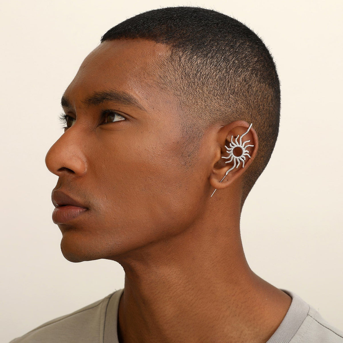 Sunfire ear cuff worn on the ear, profile view