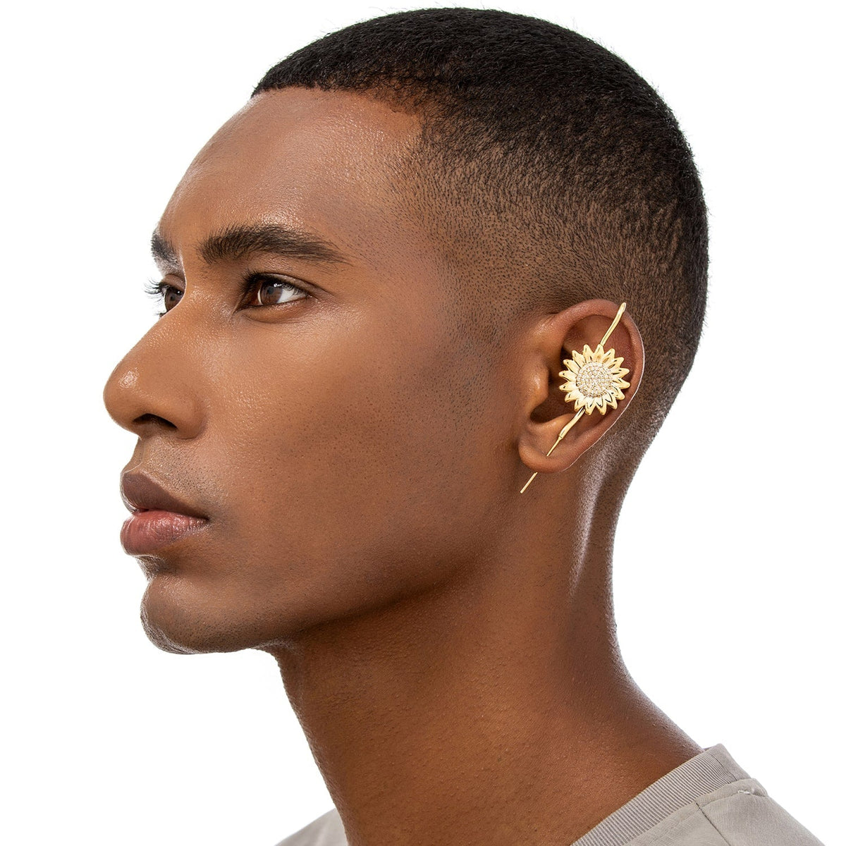 Sunflower ear cuff worn on the ear, profile view