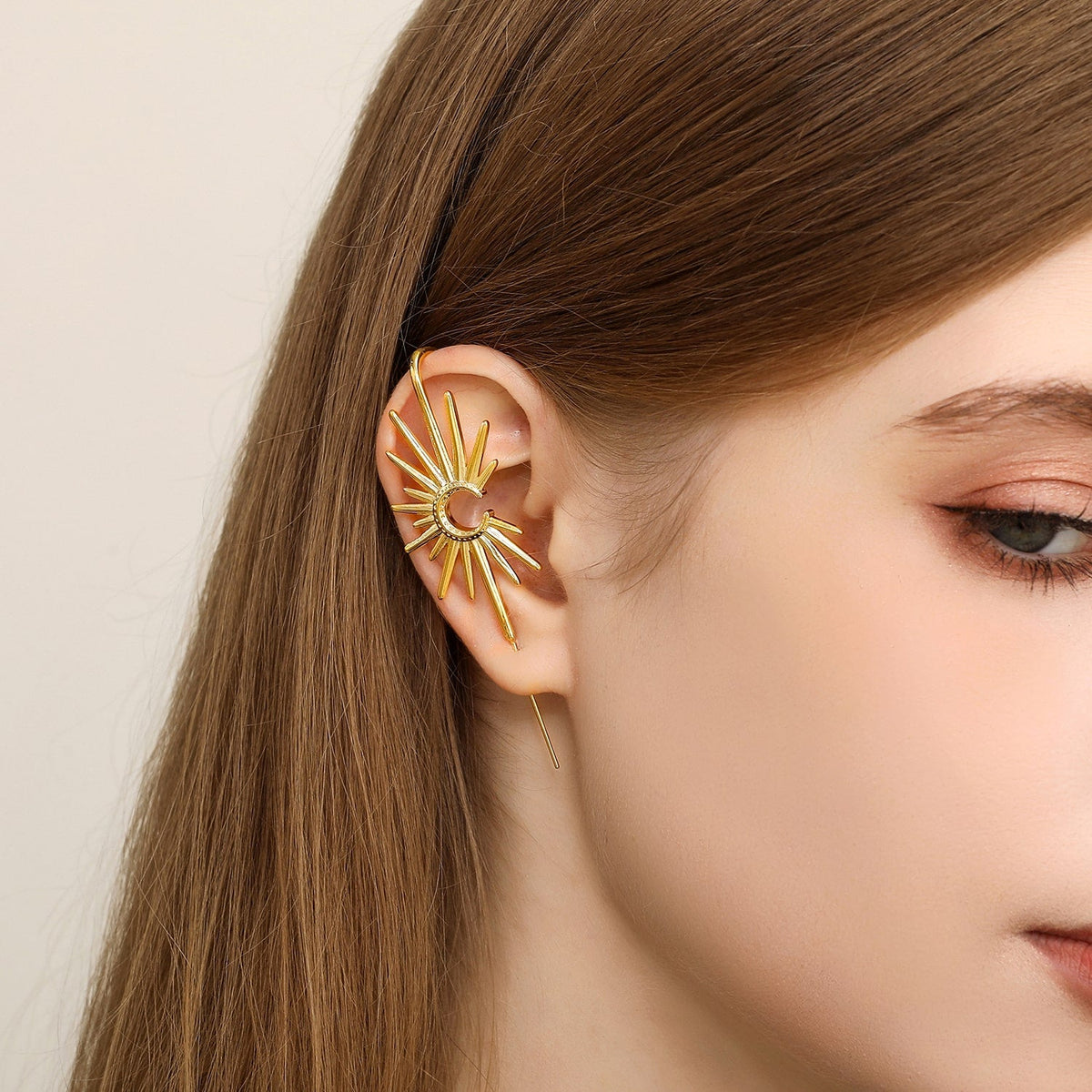 Sunray ear cuff worn on the ear, profile view