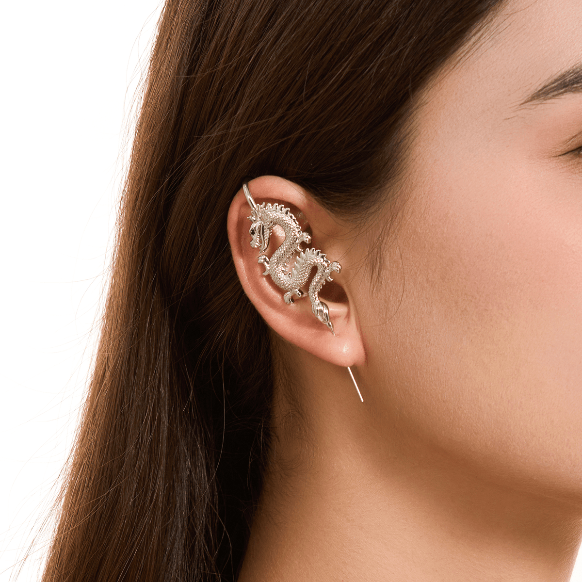 Tianlong 天龙 ear cuff in silver worn on the ear, profile view