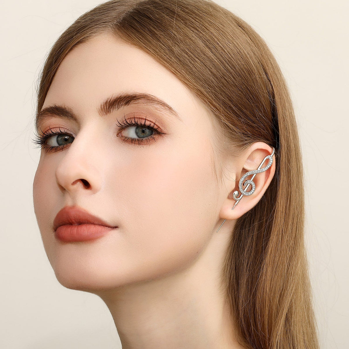 Treble Clef ear cuff worn on the ear, profile view