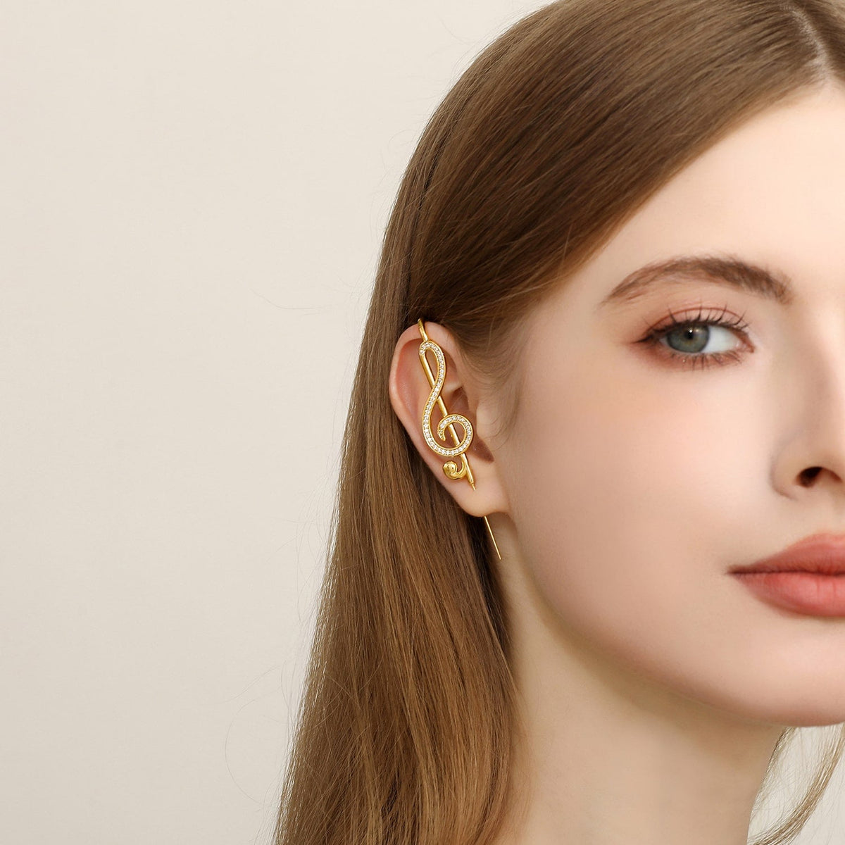 Treble Clef ear cuff worn on the ear, profile view