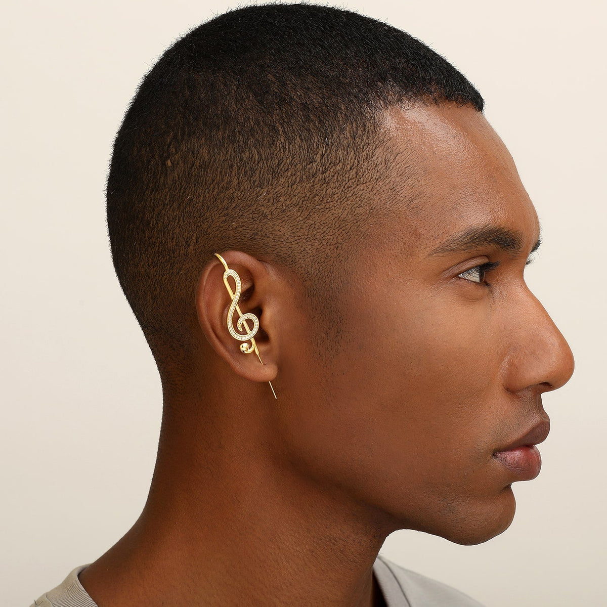 Treble Clef ear cuff worn on the ear, profile view