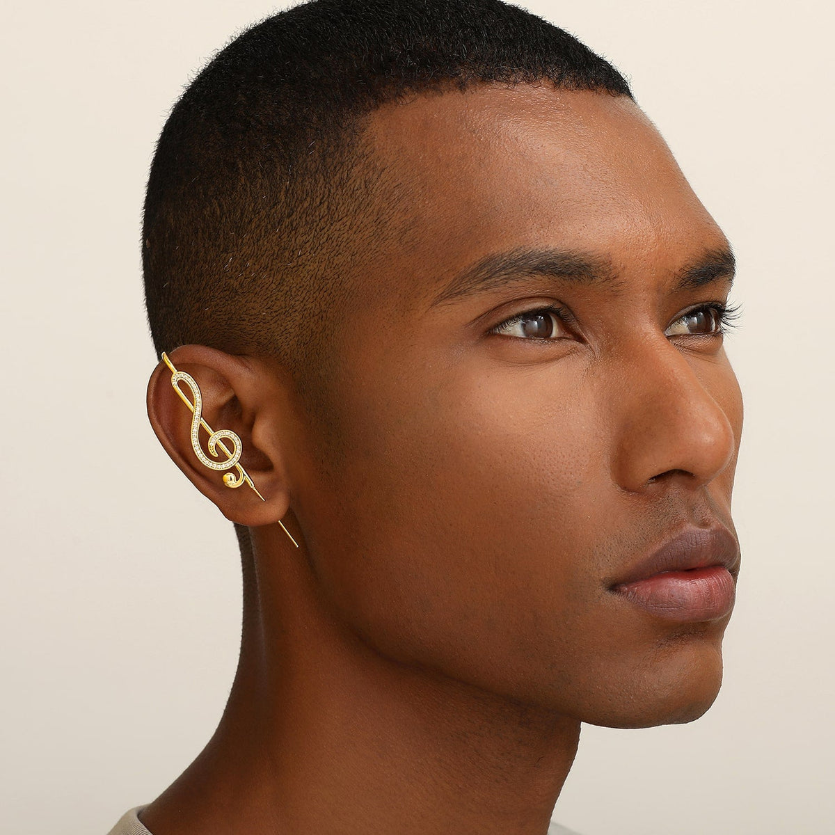 Treble Clef ear cuff worn on the ear, profile view