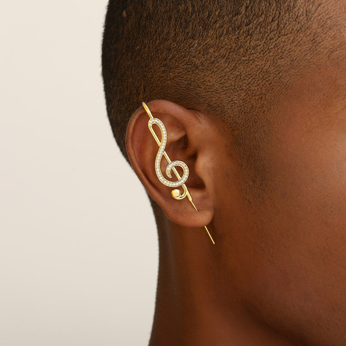 Treble Clef ear cuff worn on the ear, profile view