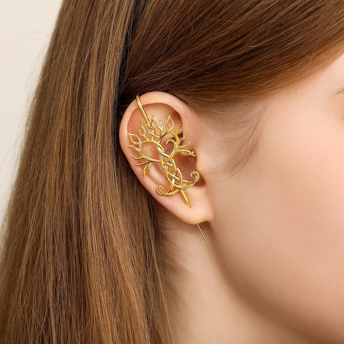 Tree of Life ear cuff worn on the ear, profile view