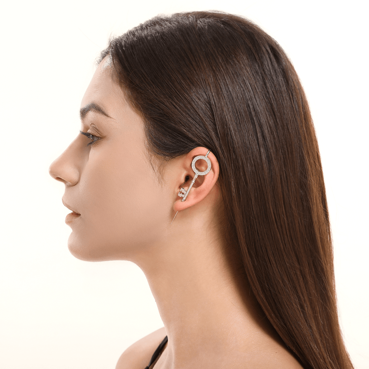 Unlocked Potential ear cuff in silver worn on the ear, profile view